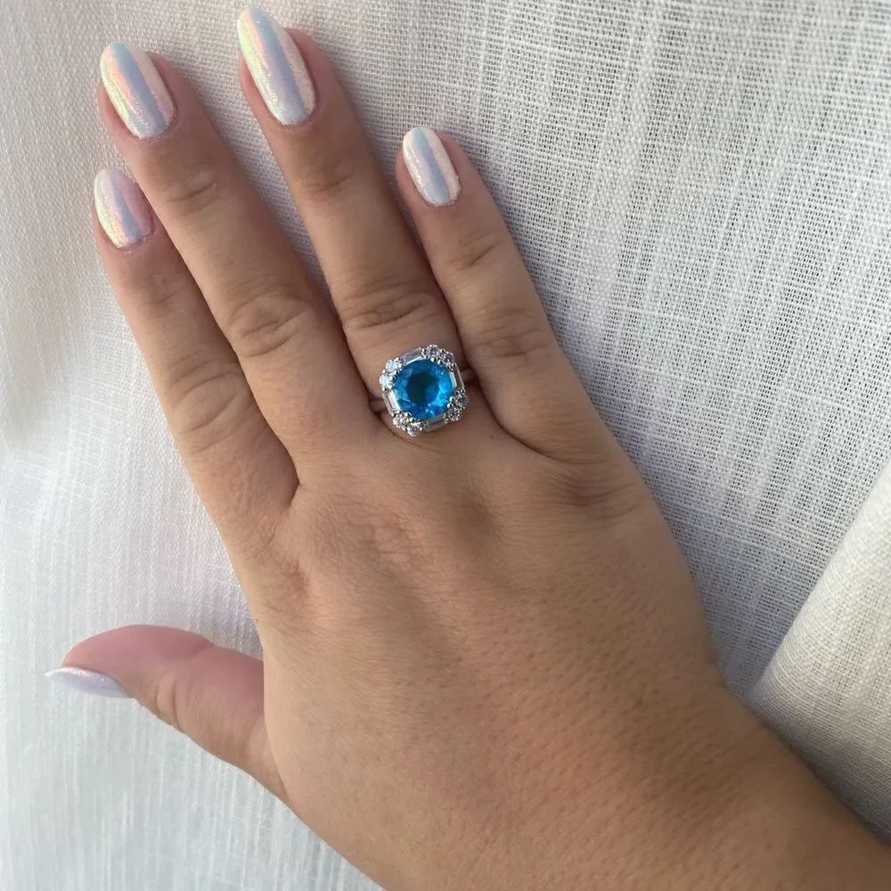 Bright blue ring that is adjustable super sparkly 💙